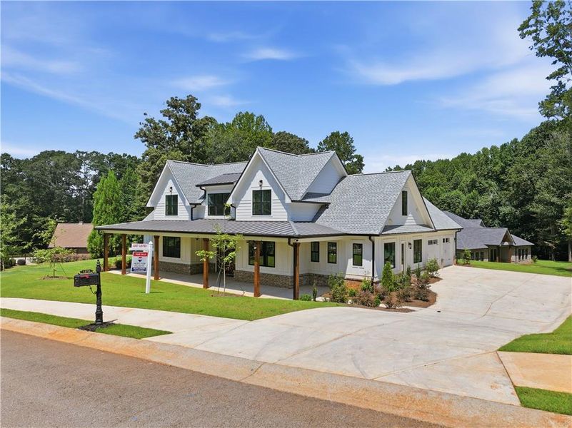 Front exterior of a new home in , Commerce, GA, highlighting curb appeal (Image 2). Front exterior of a new home in , Commerce, GA, highlighting curb appeal (Image 2).