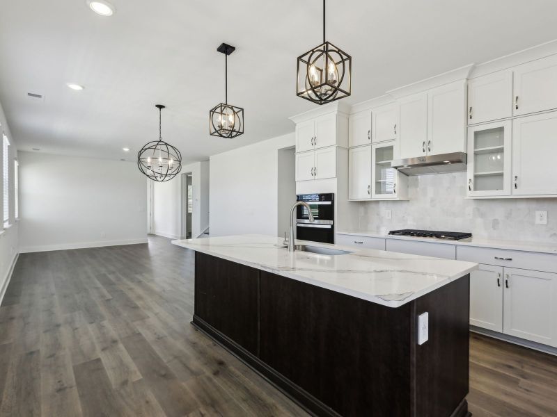 Prep dinner in the kitchen without missing the conversation in the great room. Prep dinner in the kitchen without missing the conversation in the great room.