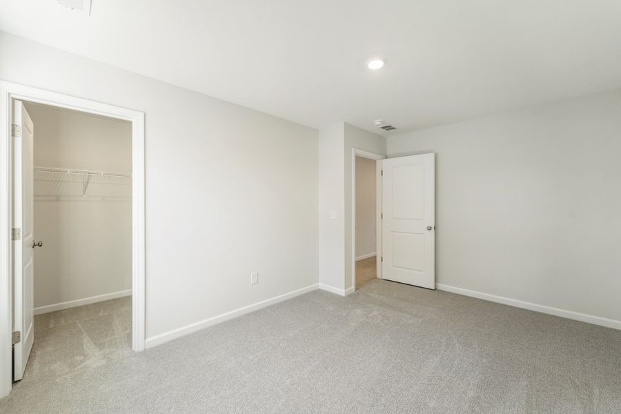 Spacious, unfurnished interior of a new home in Landing at Pine Lake, Anderson (Image 32).