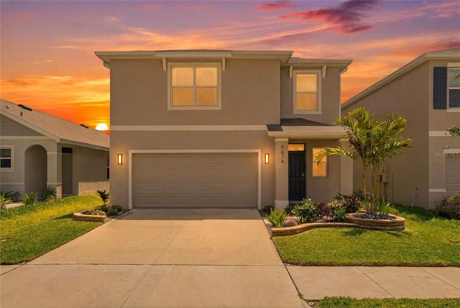 Front exterior of a new home in , Wesley Chapel, FL, highlighting curb appeal (Image 24).