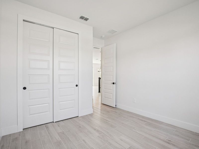 Spacious, unfurnished interior of a new home in Magnolia Bay - Reserve Series, Nokomis (Image 12).