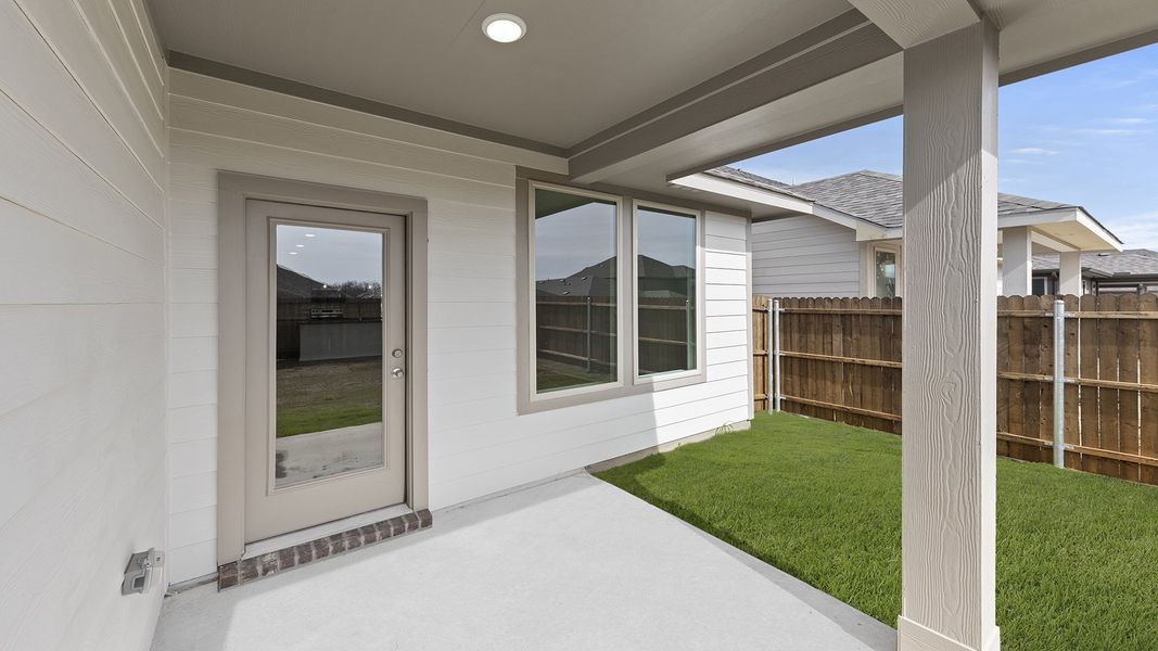 Exterior details and patio area of a home in Keeneland, Aubrey (Image 3). Exterior details and patio area of a home in Keeneland, Aubrey (Image 3).