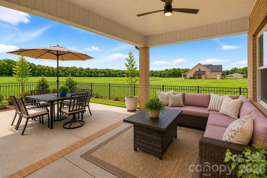 Large extended concrete patio, perfect for relaxing or entertaining.