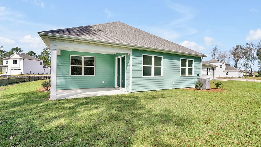 Exterior details and patio area of a home in Surfside Landing, Hubert (Image 3).