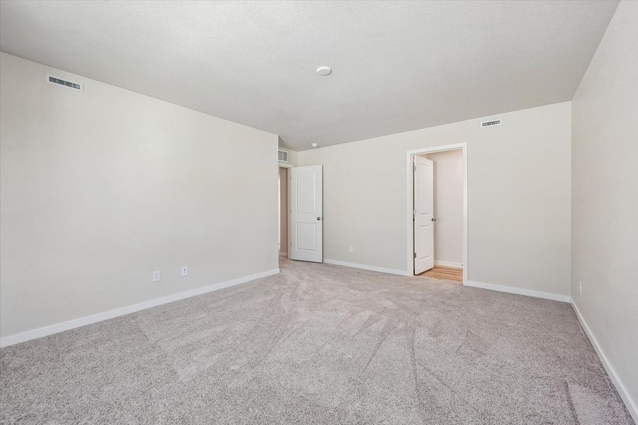 A hallway with white doors.