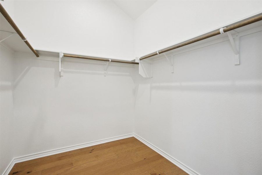 Spacious closet with wood finished floors Spacious closet with wood finished floors