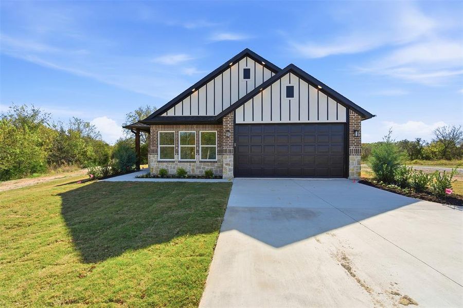 Front exterior of a new home in , Tom Bean, TX, highlighting curb appeal (Image 1). Front exterior of a new home in , Tom Bean, TX, highlighting curb appeal (Image 1).