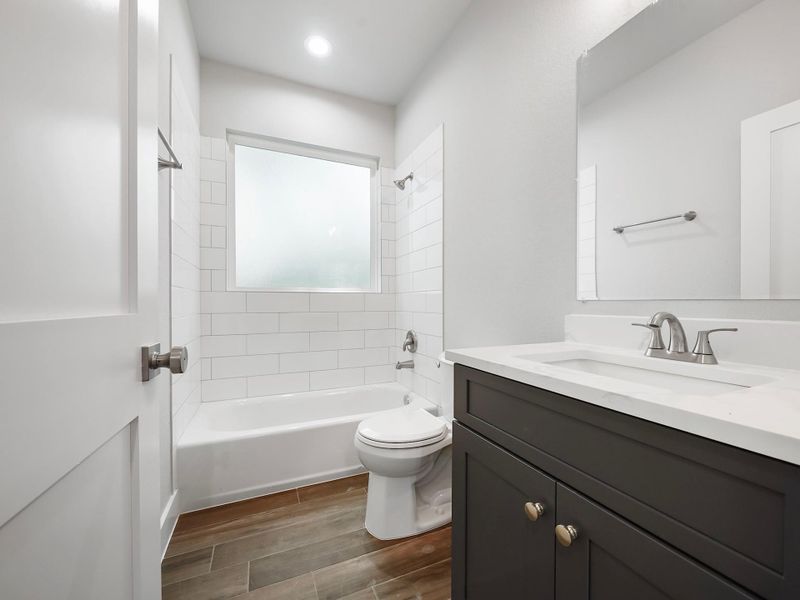 Bathroom is mix of navy blue and white cabinets Bathroom is mix of navy blue and white cabinets