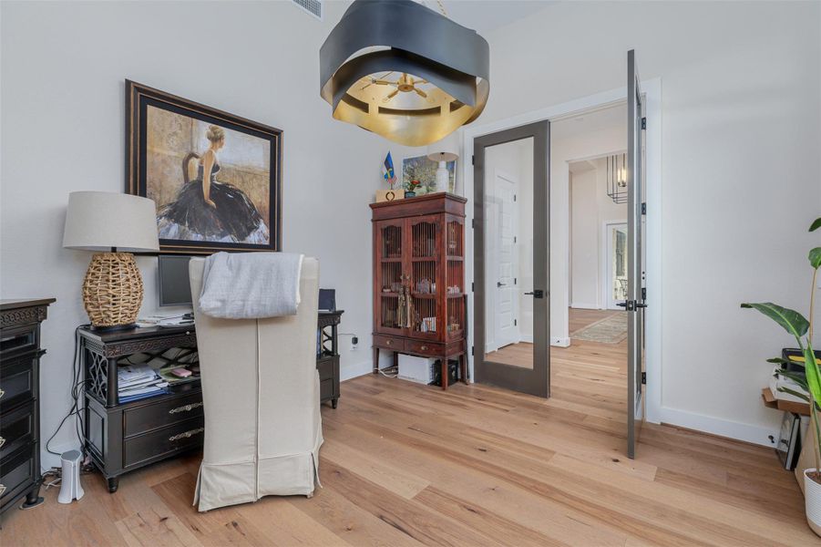 This light filled room located at the front of the house could also be used as a library or music room.  The walls are large enough for additional built ins or to display artwork.