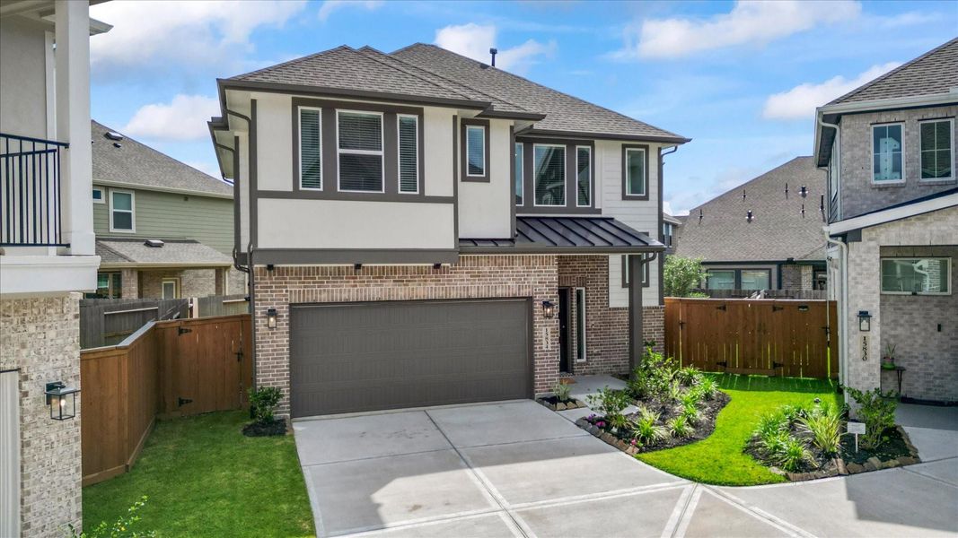 Front exterior of a new home in Balmoral, Humble, TX, highlighting curb appeal (Image 22).