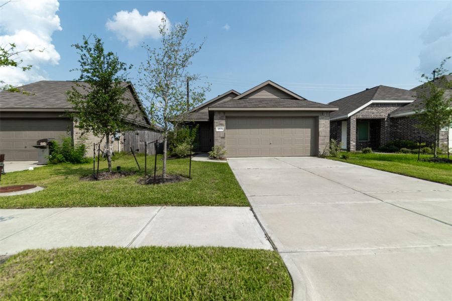 Front exterior of a new home in Burnet Fields at Baytown Crossings, Baytown, TX, highlighting curb appeal (Image 23). Front exterior of a new home in Burnet Fields at Baytown Crossings, Baytown, TX, highlighting curb appeal (Image 23).
