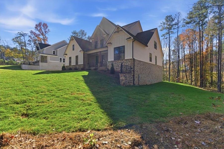 Front exterior of a new home in Ford Landing, Acworth, GA, highlighting curb appeal (Image 25). Front exterior of a new home in Ford Landing, Acworth, GA, highlighting curb appeal (Image 25).
