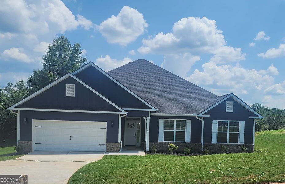 Front exterior of a new home in Holliday Pass, Griffin, GA, highlighting curb appeal (Image 1). Front exterior of a new home in Holliday Pass, Griffin, GA, highlighting curb appeal (Image 1).