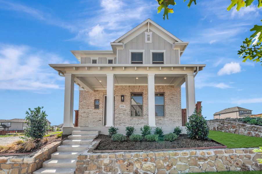 Front exterior of a new home in Walsh Cottage, Fort Worth, TX, highlighting curb appeal (Image 1). Front exterior of a new home in Walsh Cottage, Fort Worth, TX, highlighting curb appeal (Image 1).