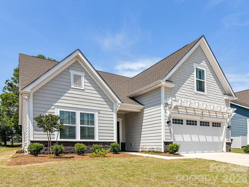 Front exterior of a new home in , Monroe, NC, highlighting curb appeal (Image 26).