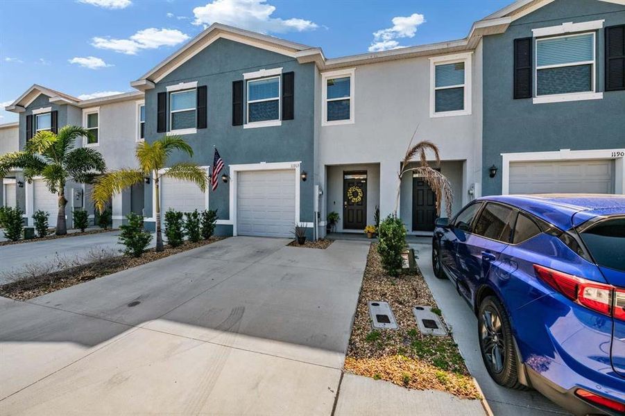 Front exterior of a new home in Azalea Shores, Largo, FL, highlighting curb appeal (Image 24).