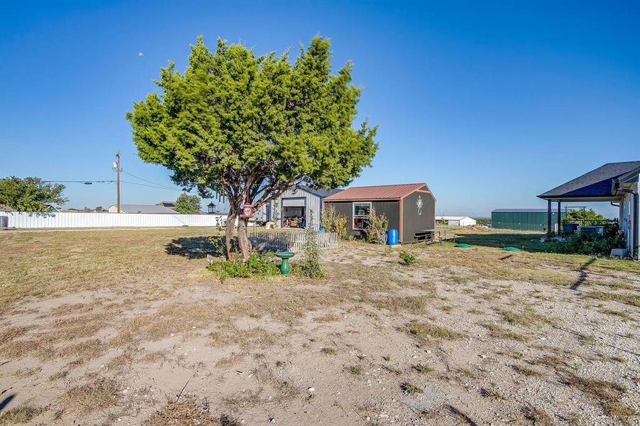 View of yard featuring a the storage shed, drive thru garage/workshop and plenty of RV/Boat parking View of yard featuring a the storage shed, drive thru garage/workshop and plenty of RV/Boat parking