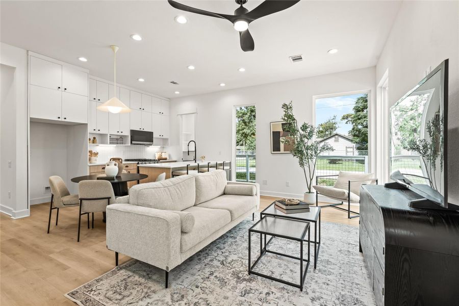 Open-concept main floor flooded with natural light — Drafthouse designed every detail Open-concept main floor flooded with natural light — Drafthouse designed every detail