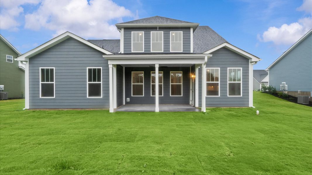 Superior curb appeal continues to the back with a refined, covered outdoor living space