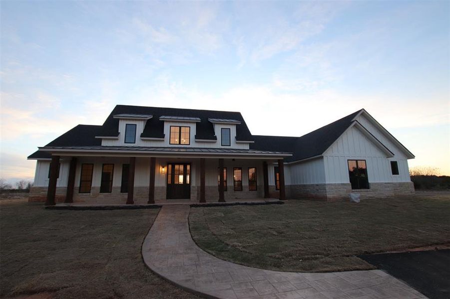 Front exterior of a new home in , Graford, TX, highlighting curb appeal (Image 1). Front exterior of a new home in , Graford, TX, highlighting curb appeal (Image 1).