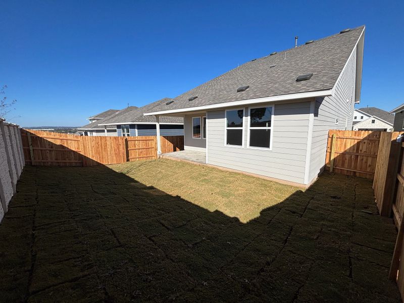 Exterior details and patio area of a home in Cannon Ranch 40s, Dripping Springs (Image 23).