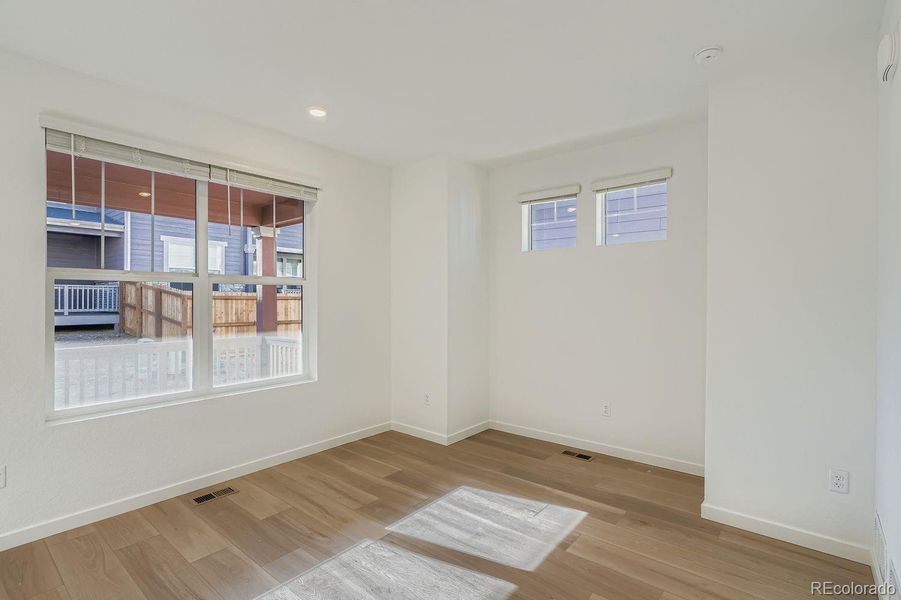 Spacious, unfurnished interior of a new home in Parterre: Paired Homes, Thornton (Image 9).