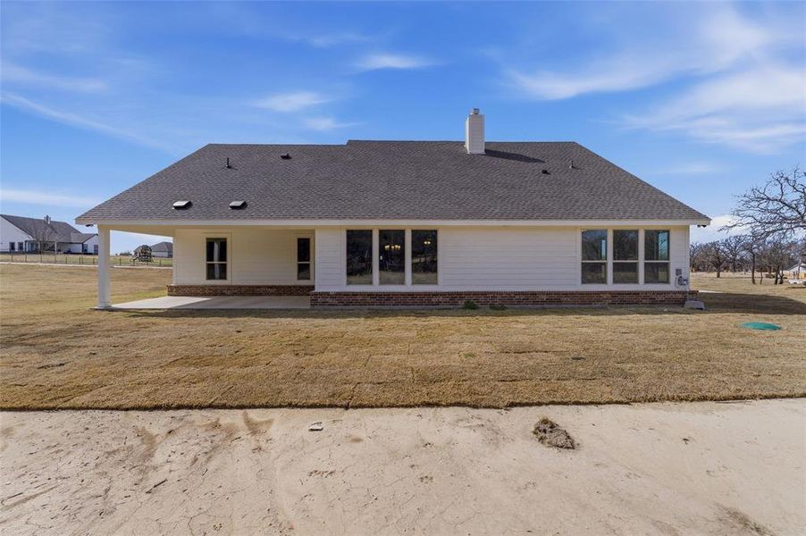 Exterior details and patio area of a home in Oak Grove Addition, Springtown (Image 17).