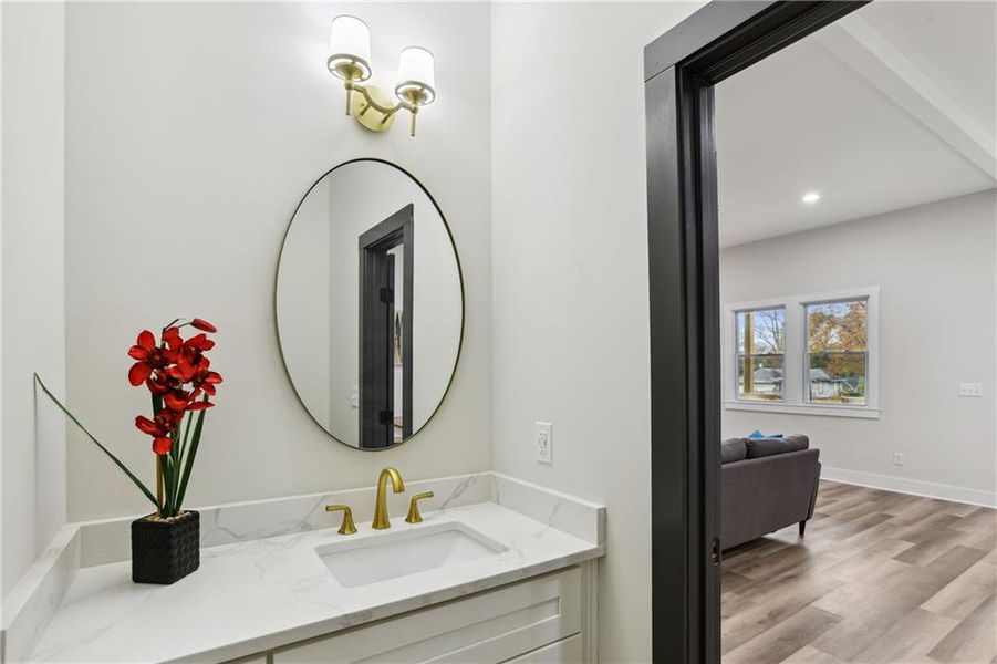 Bathroom with oversized vanity and Luxury Vinyl Plank flooring