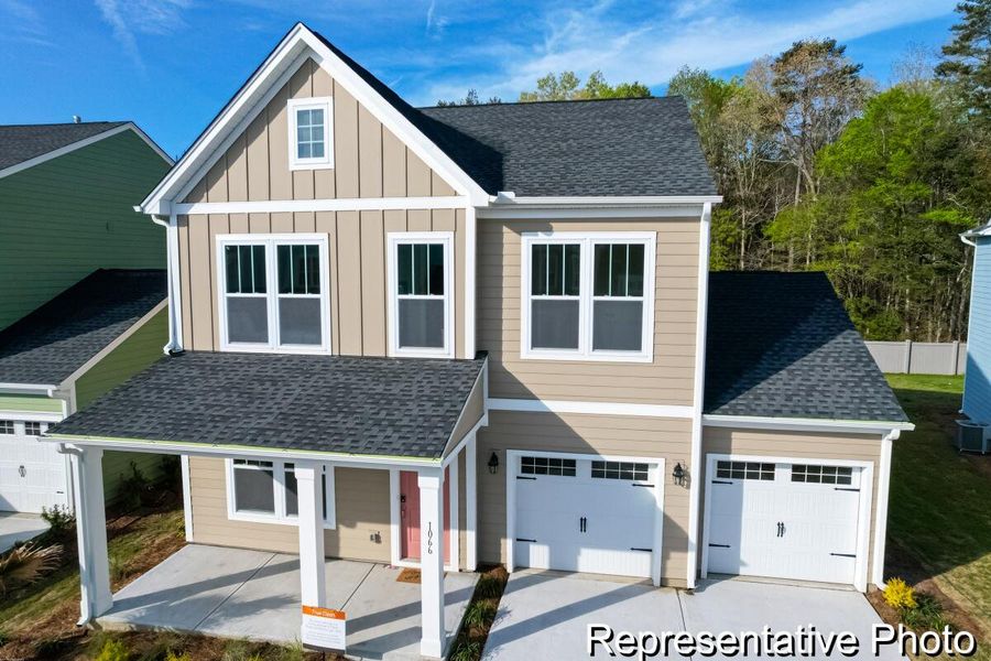 Front exterior of a new home in , Ravenel, SC, highlighting curb appeal (Image 1). Front exterior of a new home in , Ravenel, SC, highlighting curb appeal (Image 1).