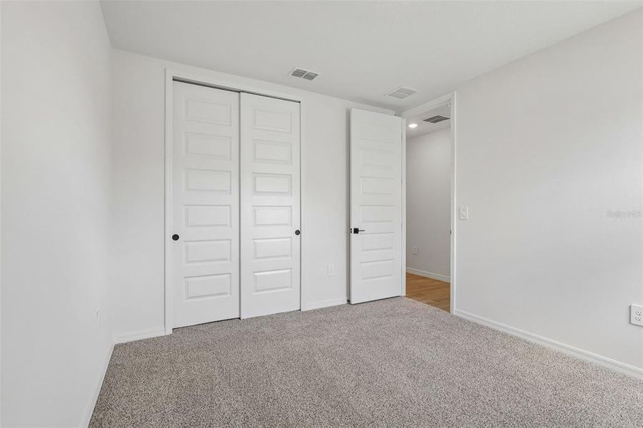 Spacious, unfurnished interior of a new home in The Grove at Stuart Crossing - Signature Series, Bartow (Image 27).