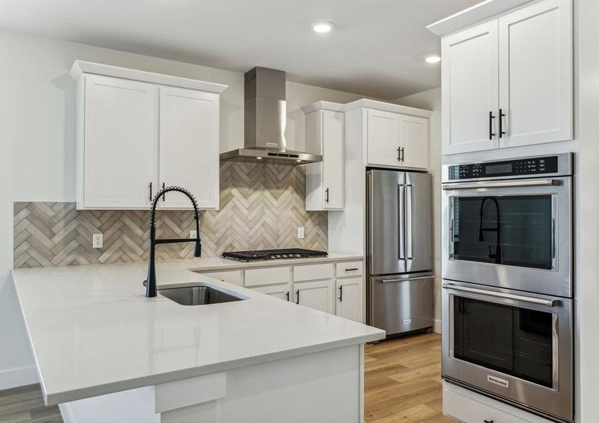 The kitchen has beautiful quartz countertops.