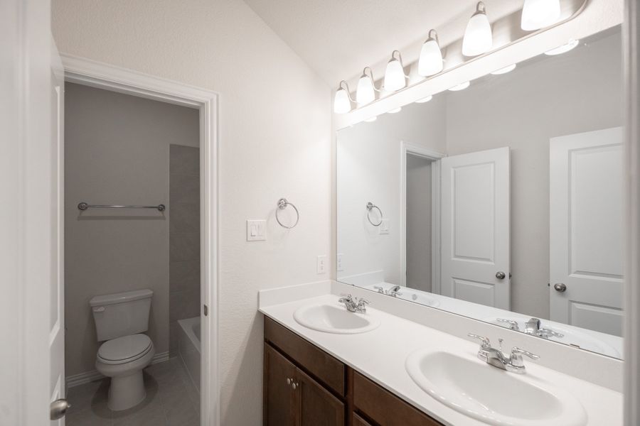 Furnished interior view inside a new home in Lake Pointe, Little Elm (Image 9).