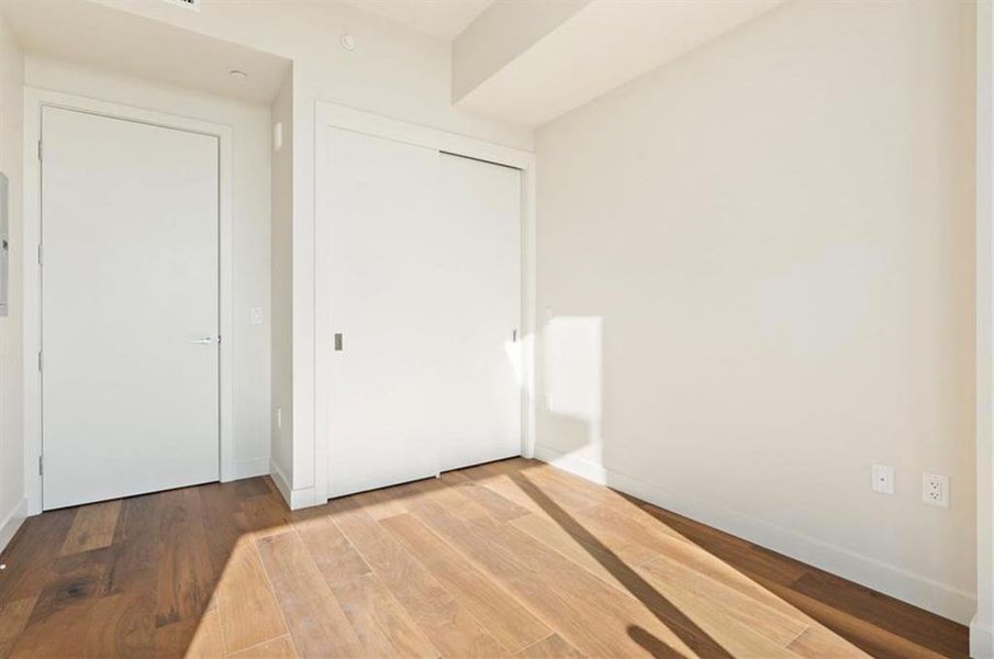 Secondary bedroom with full floor to ceiling glass