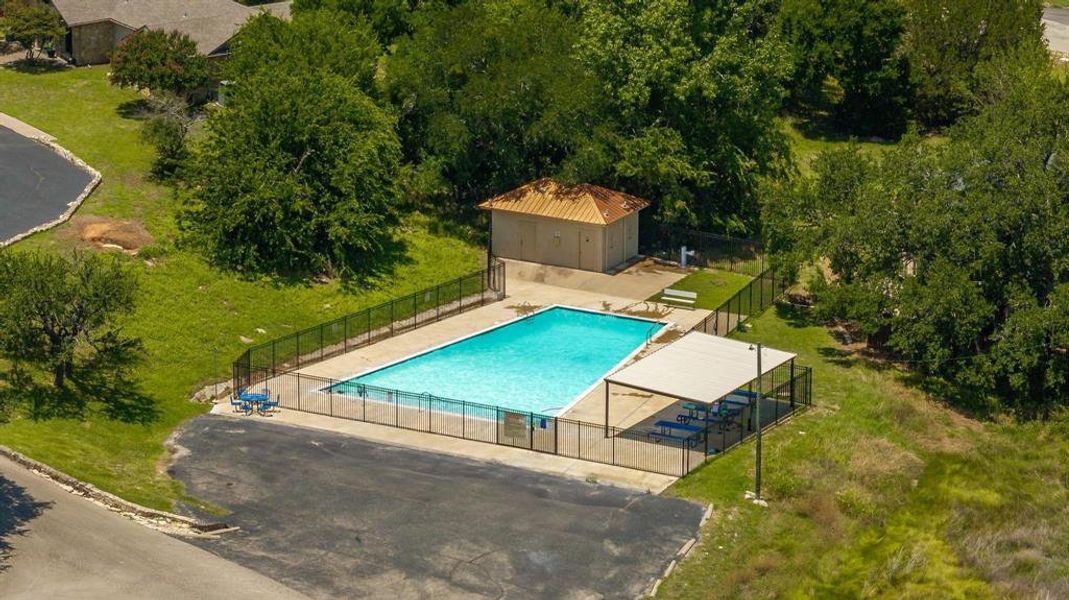 View of subject property featuring a pool area