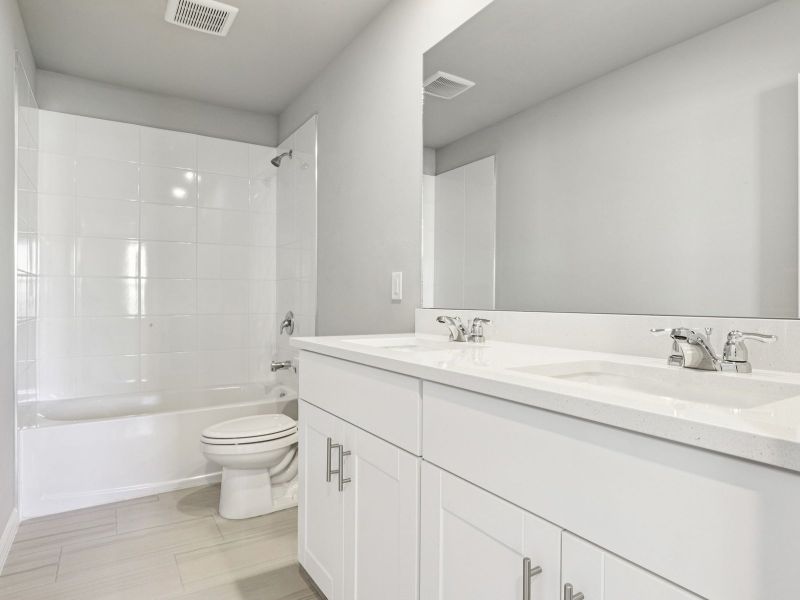 Furnished interior view inside a new home in Crescent Lakes - Premier Series, Punta Gorda (Image 10).