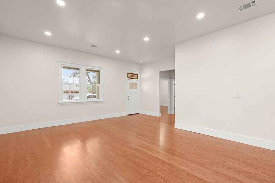 Bright hardwood flooring complements the crisp white walls and recessed lighting throughout this inviting space. Bright hardwood flooring complements the crisp white walls and recessed lighting throughout this inviting space.