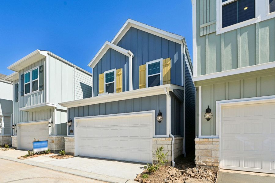 Front exterior of a new home in Kemah Crossing - City Series, Kemah, TX, highlighting curb appeal (Image 22). Front exterior of a new home in Kemah Crossing - City Series, Kemah, TX, highlighting curb appeal (Image 22).