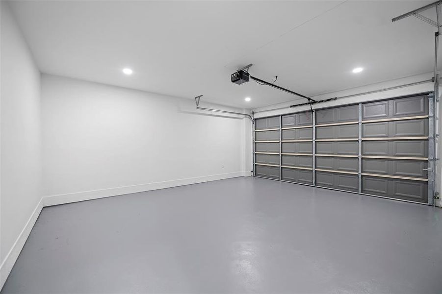 Finished Garage with beautifully painted floors auto garage door opener.