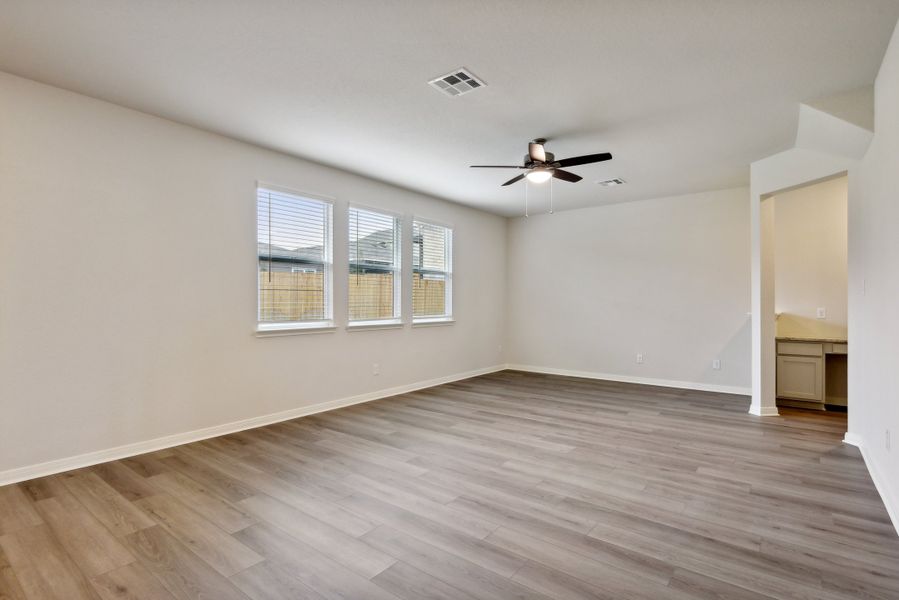 Living room in the Red River floorplan at a Meritage Homes community.