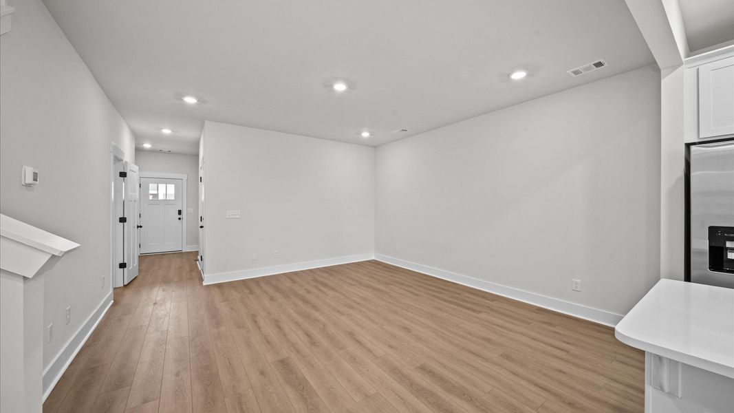 Open concept, hardwood flooring family room in two story townhome at Ransdell Pointe by DRB Homes in Spartanburg, SC Open concept, hardwood flooring family room in two story townhome at Ransdell Pointe by DRB Homes in Spartanburg, SC