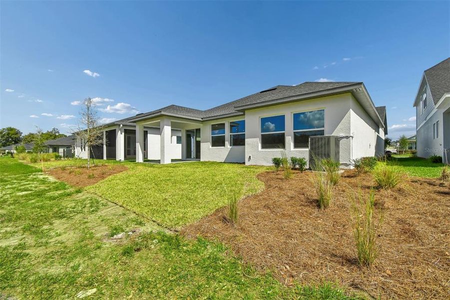 Exterior details and patio area of a home in Oakfield at Mount Dora Village Series, Mount Dora (Image 20).