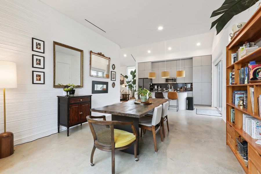 Dining area featuring concrete flooring