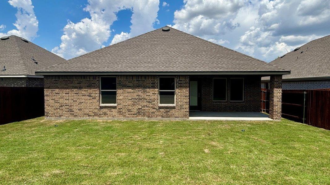 Exterior details and patio area of a home in Stonewyck Farms, Ennis (Image 2). Exterior details and patio area of a home in Stonewyck Farms, Ennis (Image 2).