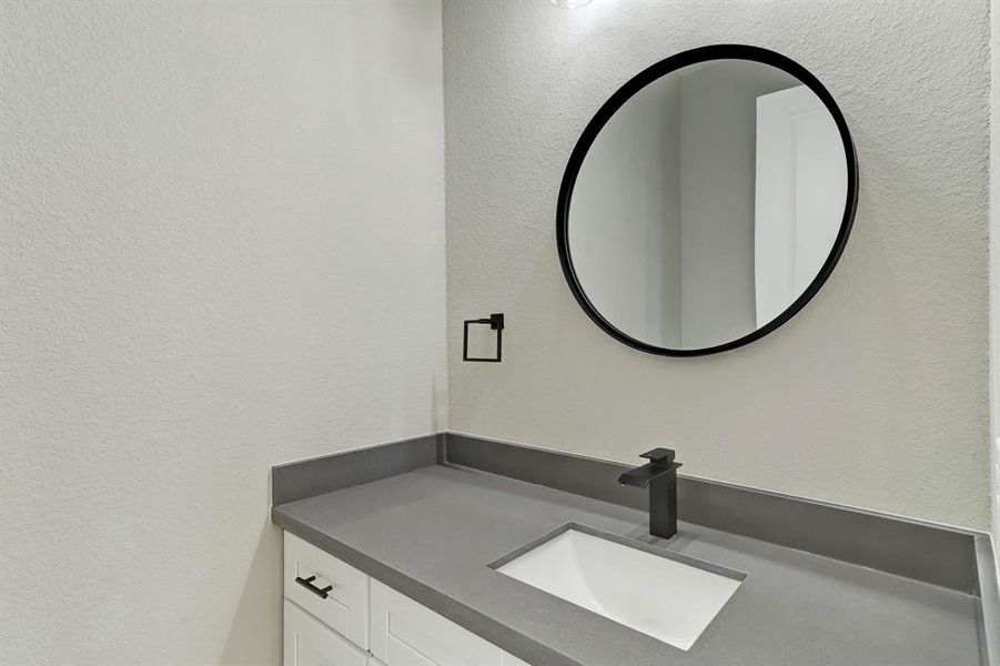 Powder room situated near living area for convenience.