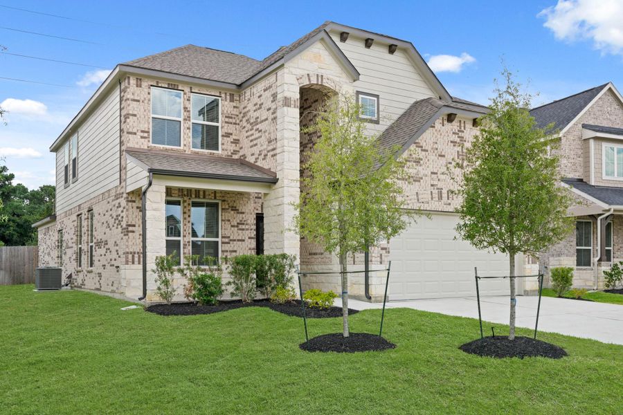 Front exterior of a new home in Grand Oaks – The Cove, Houston, TX, highlighting curb appeal (Image 14).
