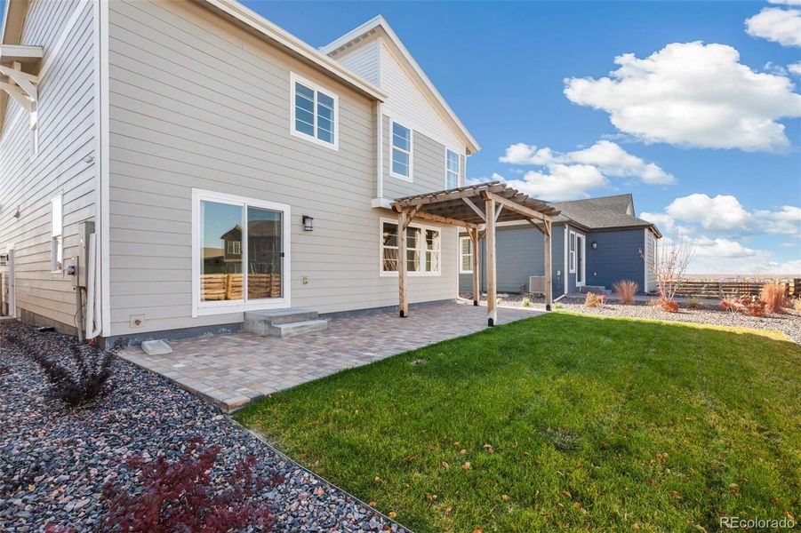Exterior details and patio area of a home in Legato, Commerce City (Image 12).