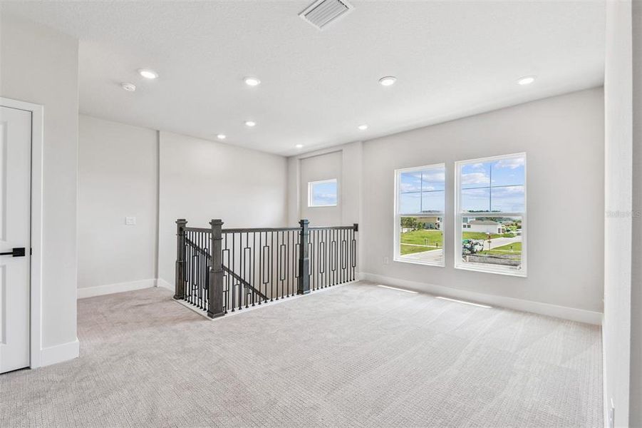 Spacious, unfurnished interior of a new home in Emerald Landing at Waterside at Lakewood Ranch – Cottage Series, Sarasota (Image 13).