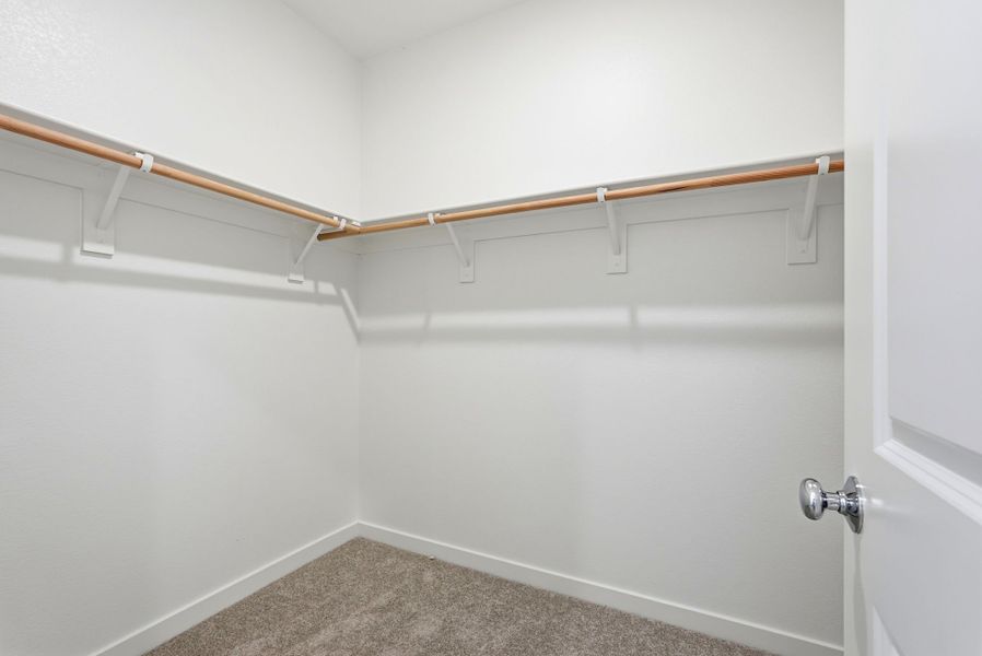 A white wall with a metal bar. A white wall with a metal bar.