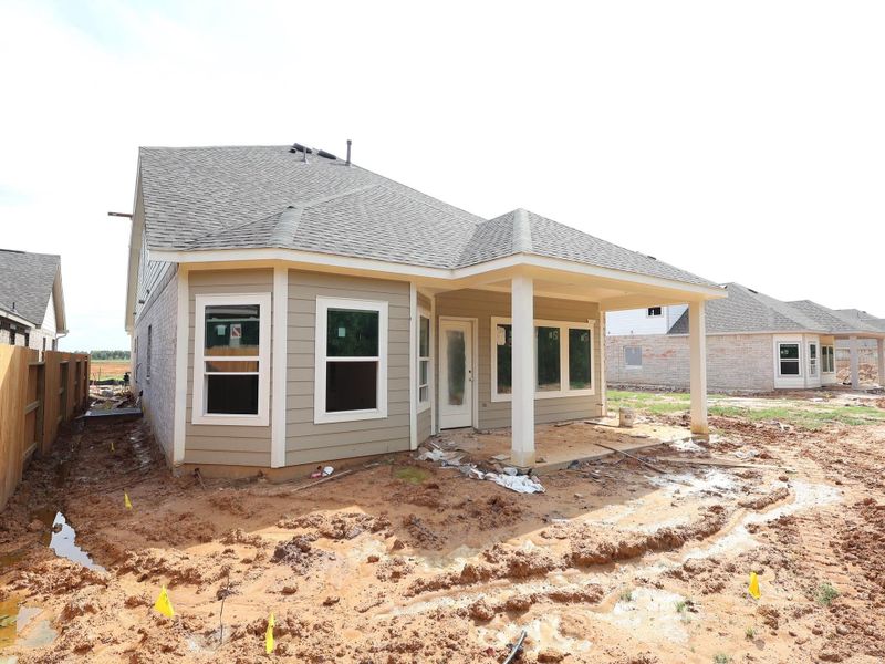 Front exterior of a new home in Sorella, Tomball, TX, highlighting curb appeal (Image 1).