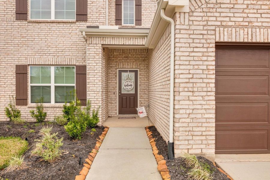 Front exterior of a new home in Marvida, Cypress, TX, highlighting curb appeal (Image 24).